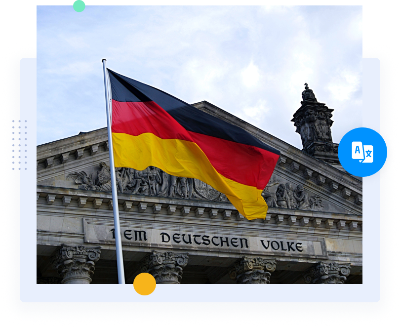 Eine deutsche Flagge vor einem historisch anmutenden Regierungsgebäude.