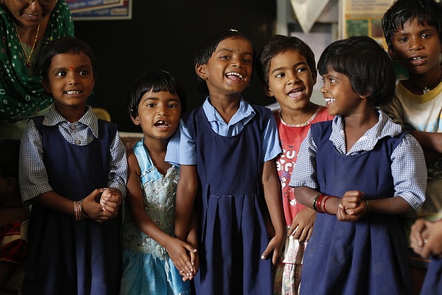 Students stand together in their school uniform.