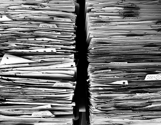 Two stacks of documents beside each other.