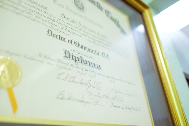 A diploma certificate in a frame.
