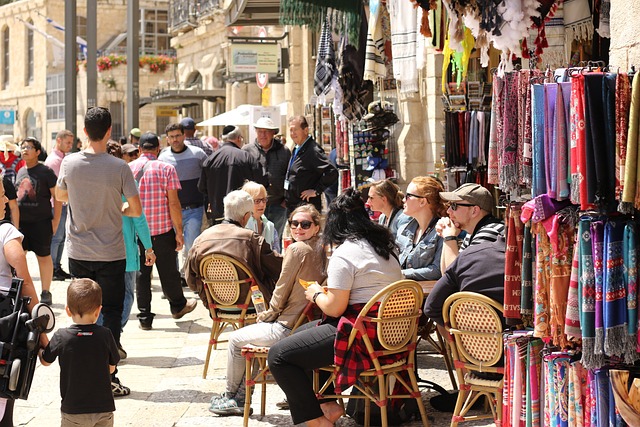 A busy market street in the daytime.
