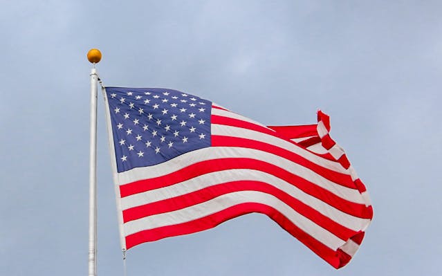 A U.S. flag flies around in the wind.