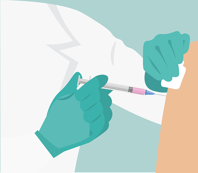 An illustration of a healthcare provider injecting a person’s shoulder with a vaccine.
