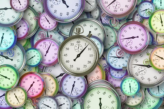 Close-up view of a pile of colorful stopwatches.