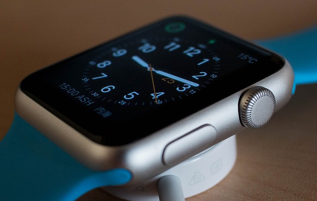 Close-up view of a blue and silver smartwatch.