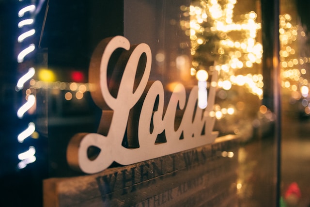 A store window sign used to spell “Local.”
