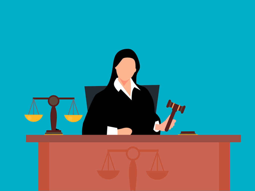 An illustration in which a judge holds a gavel.
