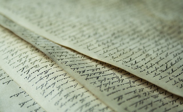 Close-up view of handwritten texts on pieces of old paper.
