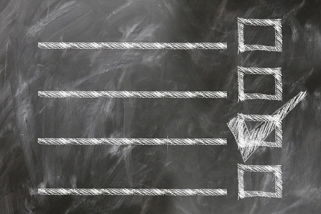 An empty list on a blackboard with a checkmark in one of several boxes.
