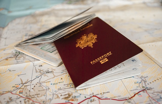 A travel passport is on a map.
