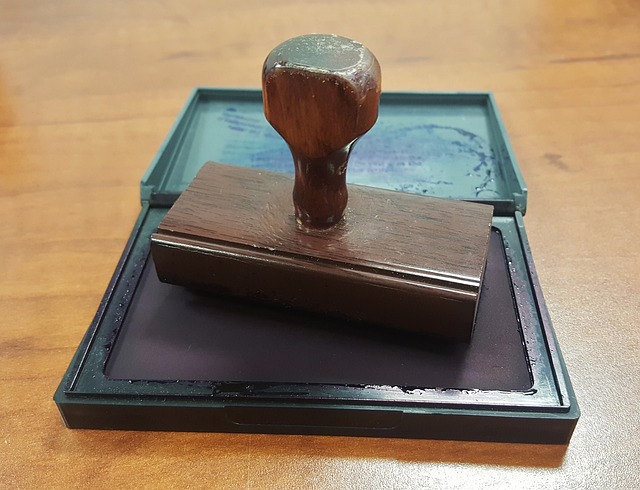 A wooden stamp on a wooden table.
