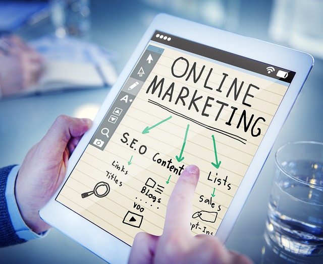 A person holds a tab that shows an online marketing strategy.
