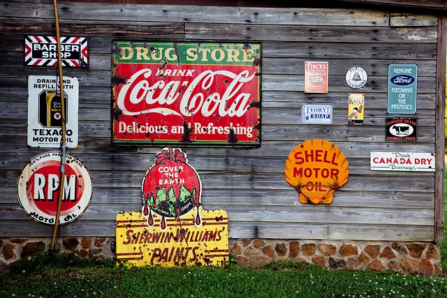 Several advertising signs on a wall.
